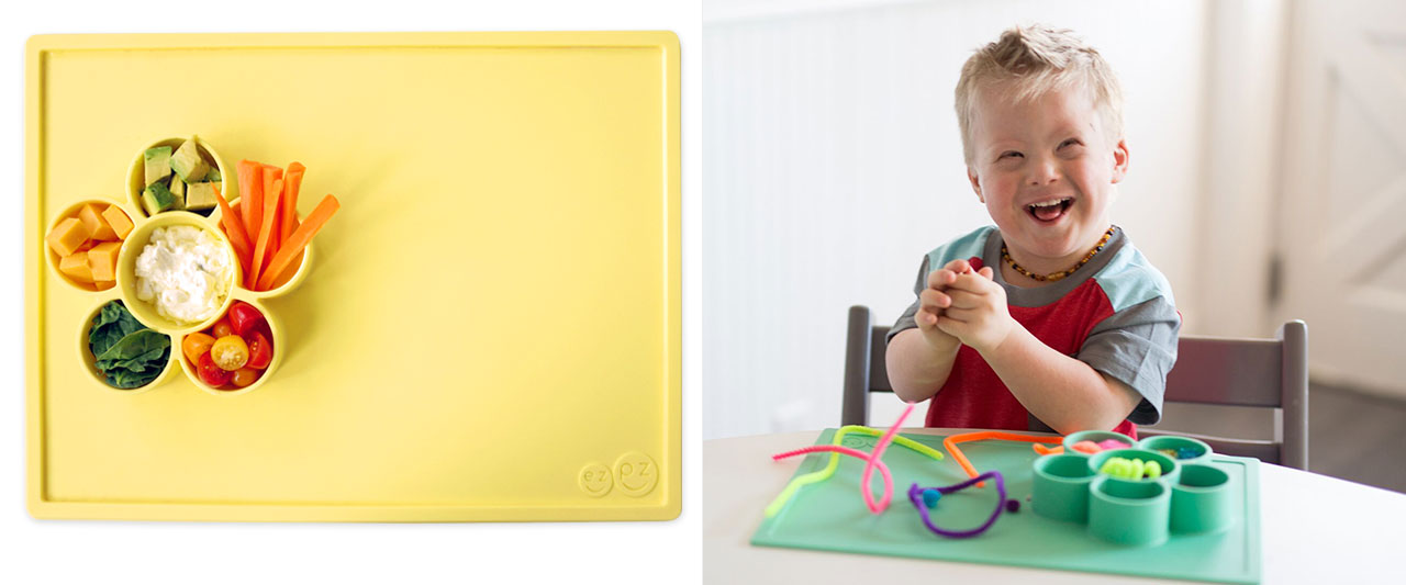 nibble buffet for picky eaters with a ezpz Play Mat and boy with downs syndrome playing with the ezpz Play Mat