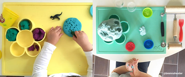 toddlers using the ezpz Play Mats for Play Doh fun