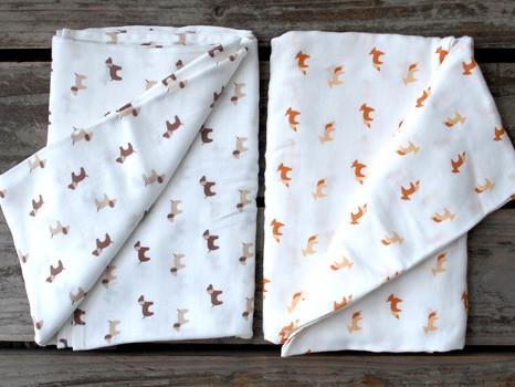 Nest Designs Blankies in Fox and Hound on wooden table.