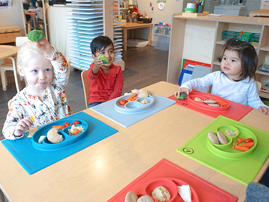 three preschoolers in a child care centre having lunch with ezpz