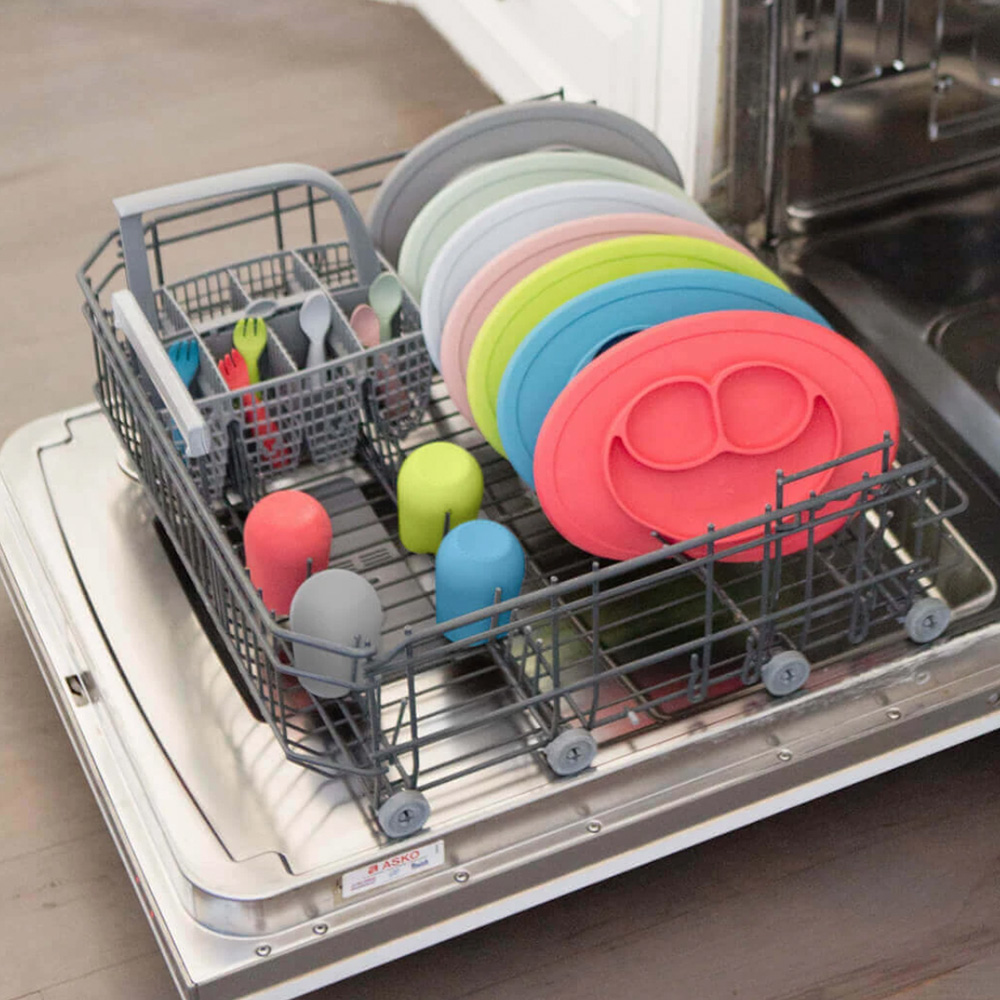 Open dishwasher, filled with ezpz products which are dishwasher safe