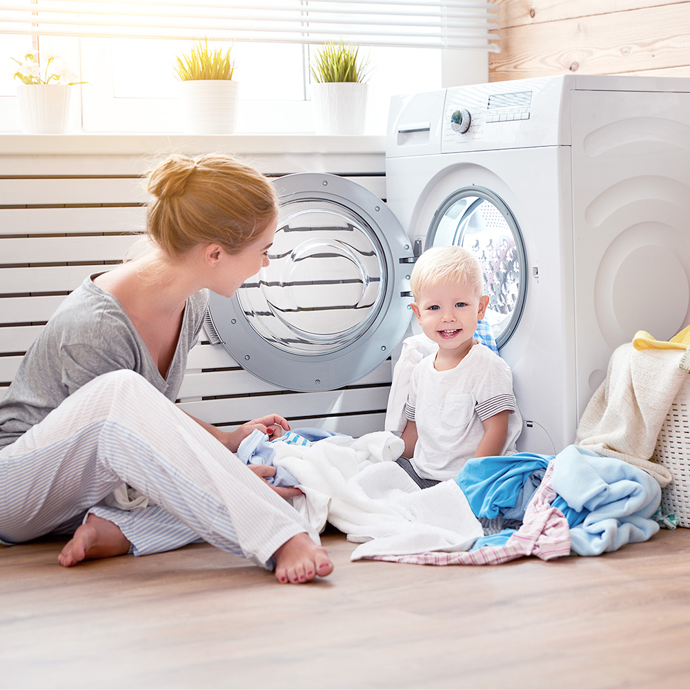 Photo of a mother and son in the laundry room